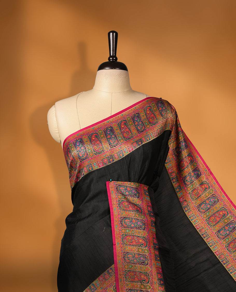 Black colour Pashmina silk saree plain body, framed by an opulent arabesque border and grand storytelling pallu, paired with a matching woven border blouse piece