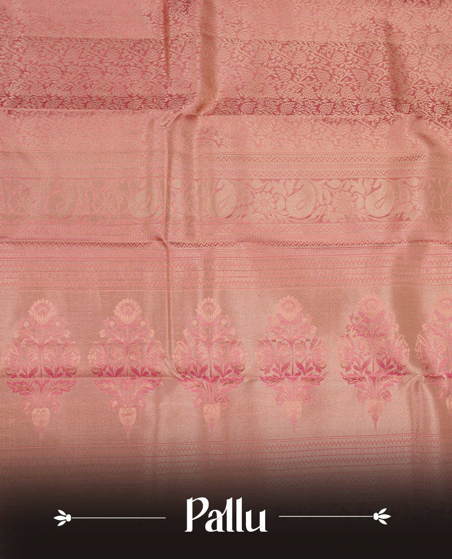 Powder pink Kancheepuram silk saree featuring floral jacquard on the body with a traditional border, paired with a matching blouse piece.