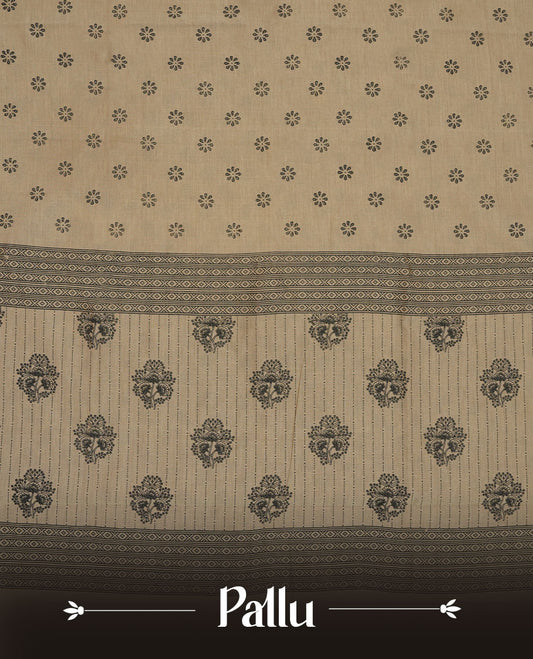 Dark Beige colour poly cotton saree with black floral butti motifs on the body, paired with a matching pallu featuring black ornate floral jaal and stripes on the border, and a coordinated all‑over black paisley printed blouse piece.