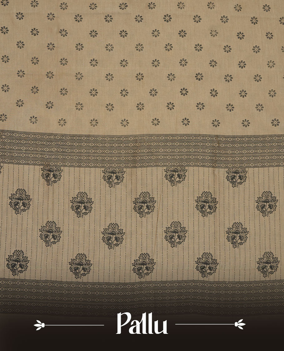 Dark Beige colour poly cotton saree with black floral butti motifs on the body, paired with a matching pallu featuring black ornate floral jaal and stripes on the border, and a coordinated all‑over black paisley printed blouse piece.