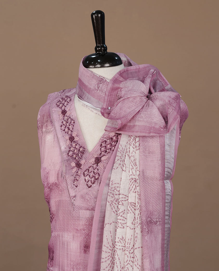Mauve colour churidhar material featuring printed body thread worked neckline, paired with matching bottom and Dupatta.