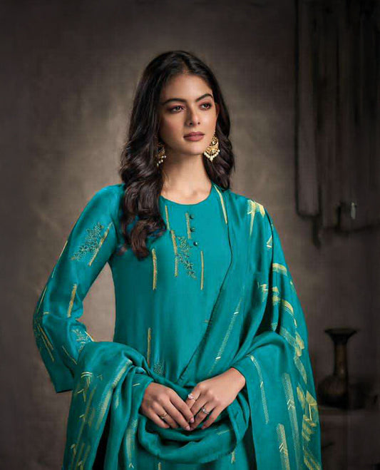 Pine green colour suit material with Rubina silk top adorned with elegant embroidery work, paired with luxurious satin bottoms, and completed with a muslin jacquard dupatta featuring rich woven detailing