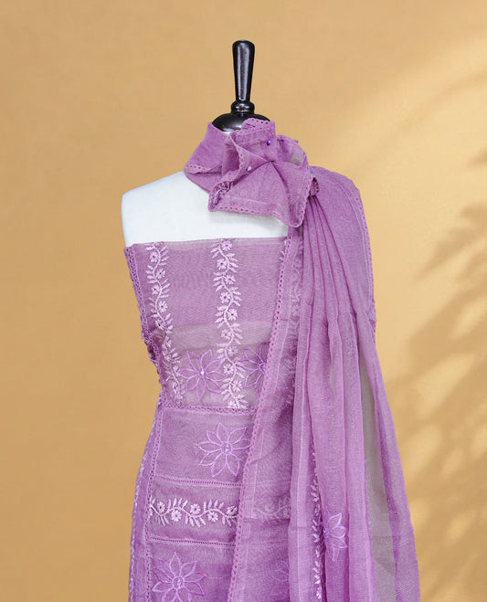 Purple colour Salwar material featuring Self colour Floral Thread pattern, Matching bottom and paired with Same colour with thread patterned Dupatta.