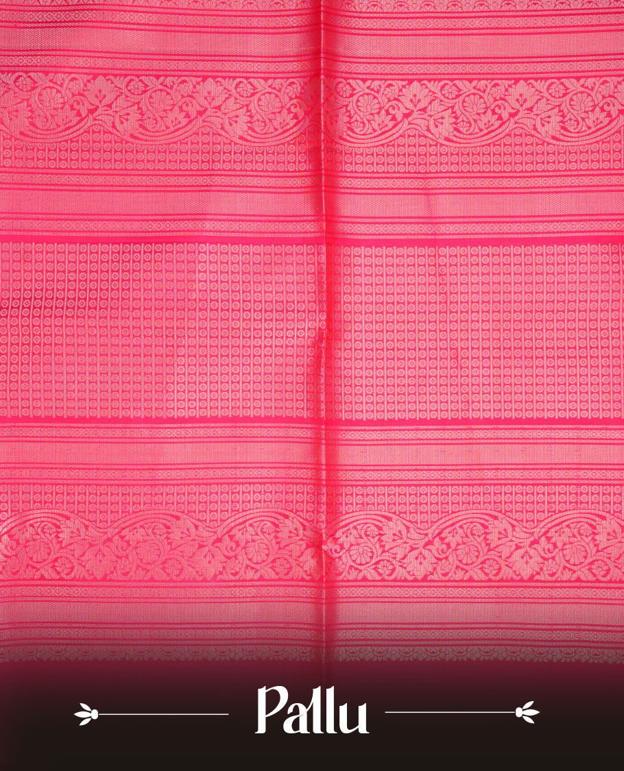 Rani pink colour soft silk saree featuring gold zari motifs on body, complemented by self colour with traditional border with tassel at pallu, paired with matching blouse piece.