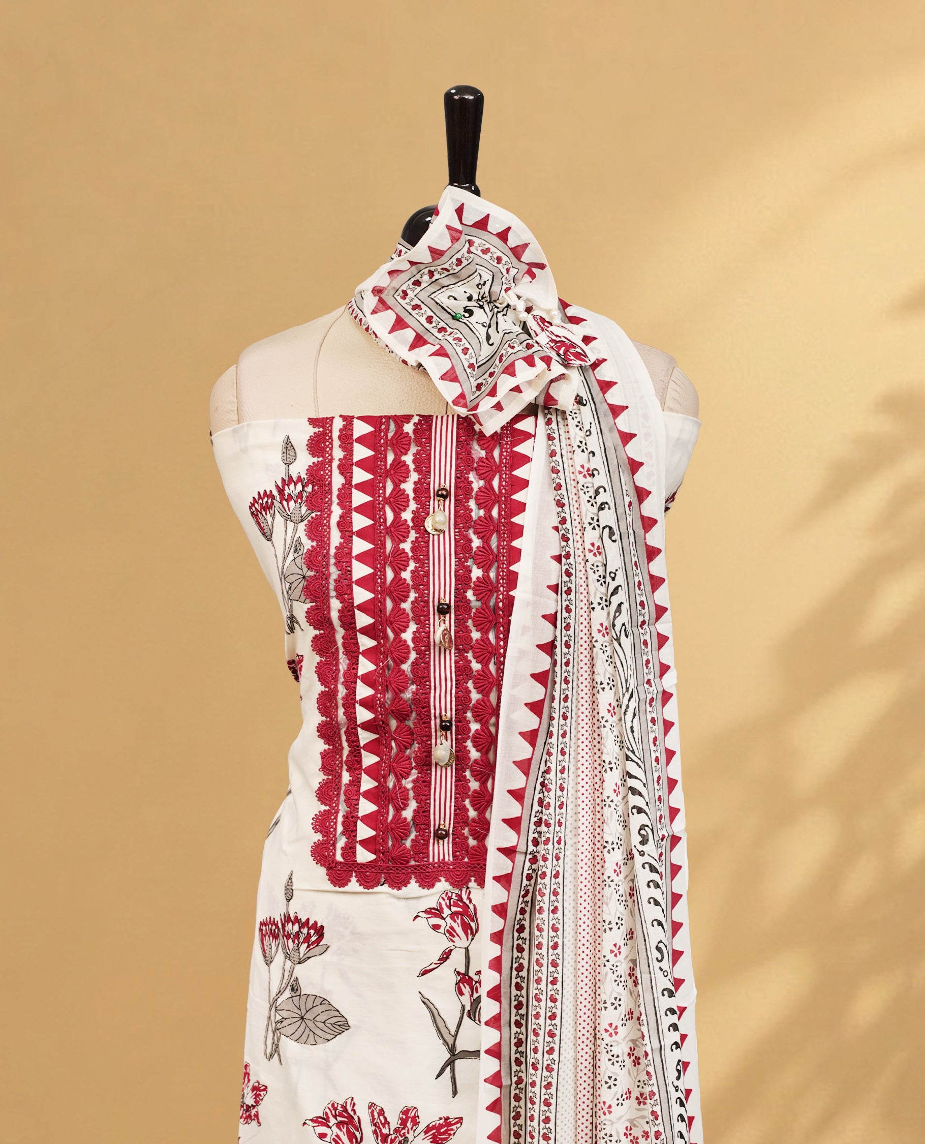 Cream colour Salwar Material Featuring Elegant Lace, Floral Printed body, paired with matching bottom Piece And Matching dupatta.