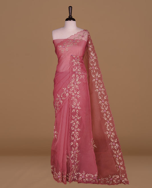 Mauve colour crush organza saree featuring gold threan floral and stone worked body, highlighting scalp designed border, paired with matching blouse piece.