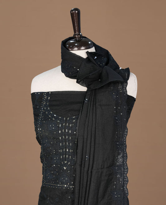 Black colour churidhar material featuring self colour thread and sequins work on body, paired with matching bottom and Dupatta.
