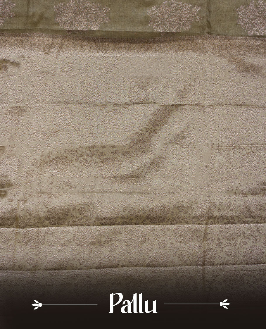 Dry olive colour pure banaras tusser silk saree highlighting antique zari pattern across body, with contrast cream colour with zari border and paired with matching blouse