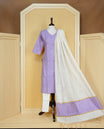 Lavender colour churidar set featuring subtle woven motifs on the kurta, paired with matching solid pants and an off-white dupatta .