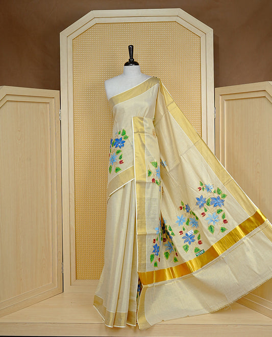 Cream colour Tissue kerala saree featuring Embroidery buttas on body, complemented by Floral thread work with Print & kasavu kara, comes with matching blouse piece.
