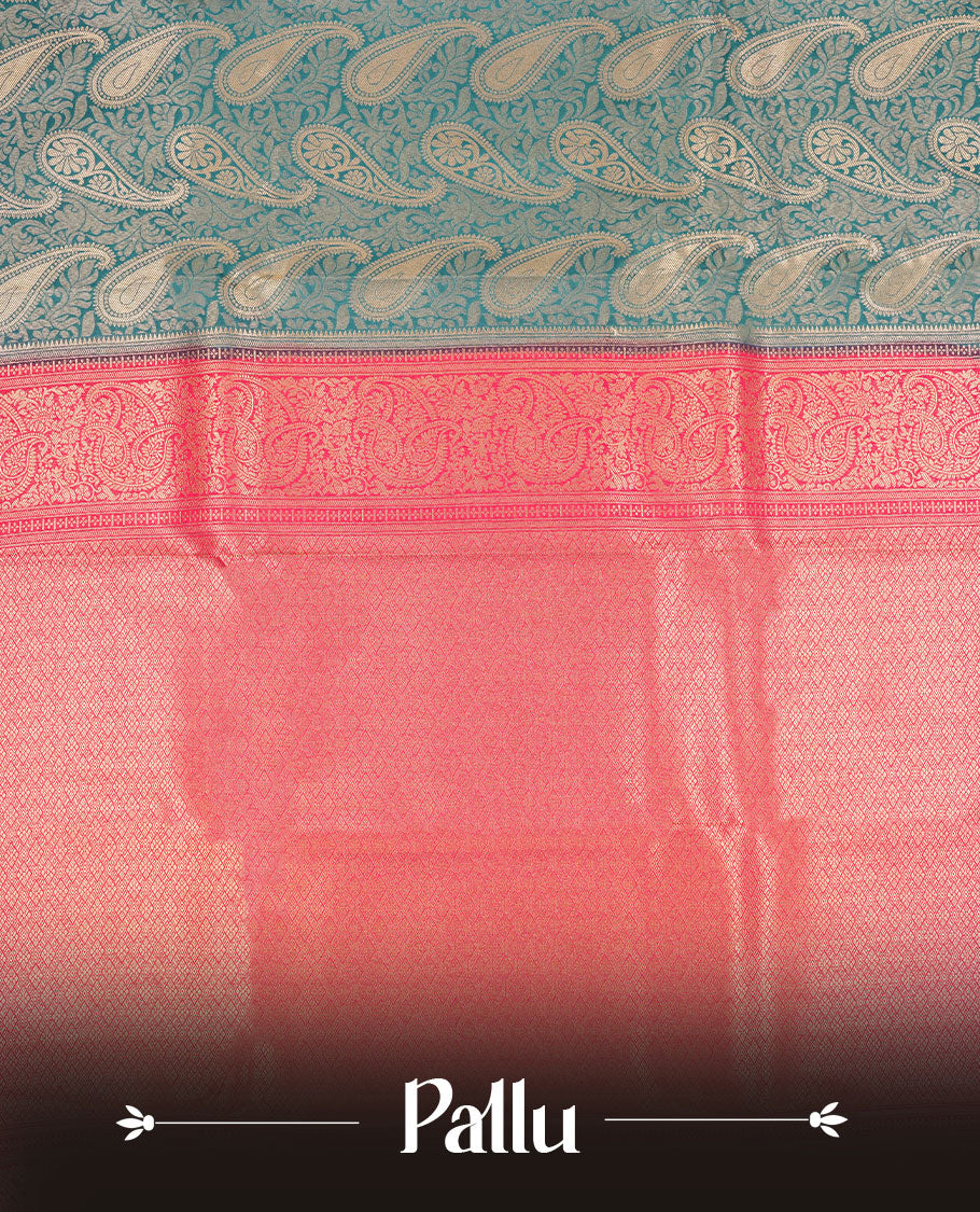 Blue colour semi silk brocade saree featuring intricate Gold Floral kodi & leaf patterns across the body, complemented by a contrast Magenta colour woven border and pallu, paired with a matching blouse.