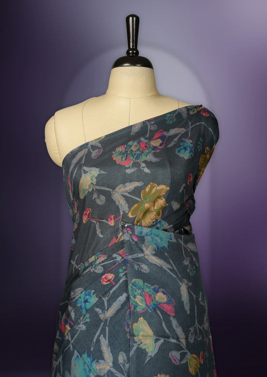 Grey colour saree enhanced with a vibrant multiple colour floral prints on body & pallu, and  comes with a matching blouse.