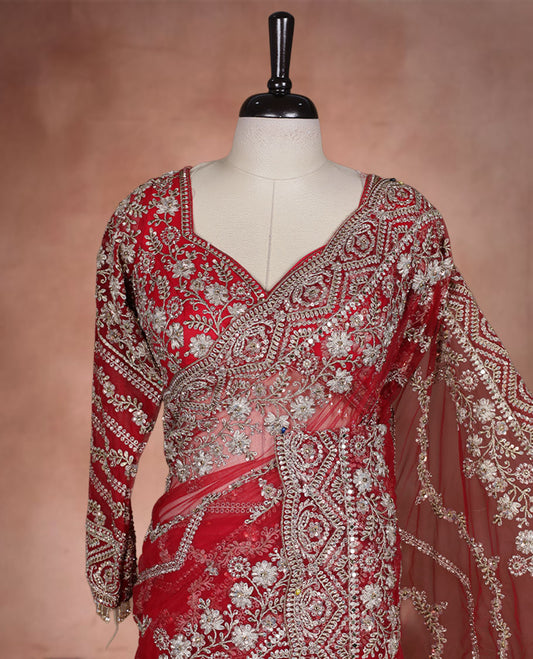 Red Colour net designer Wedding saree featuring all over floral embroidery with sequin detailing and an ornate scalloped border, finished with a matching embellished blouse.