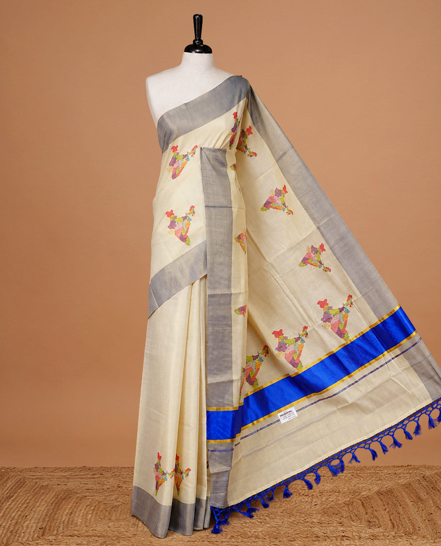 Cream Colour Kerala Saree Featuring  Plain Body ,Complemented By A Blue Zari With Indian Map Border ,Enhance By A  Gold Zari & Blue Pallu ,Paired With A Matching Blouse Piece.