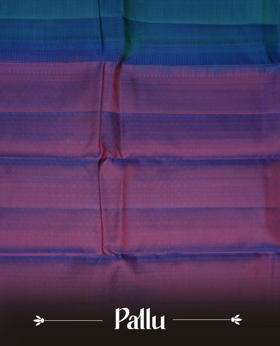 Peacock blue colour soft silk saree featuring zari pattern on body, complemented by a contrast purple zari patterned body, paired with matching blouse piece.