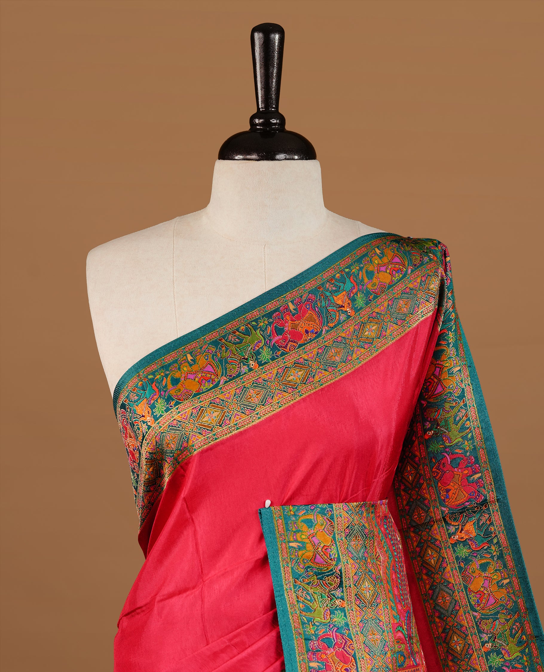 Pink colour Pashmina Saree featuring a plain lustrous body, a multicolour traditional woven border, a rich traditional woven pallu with temple and floral motifs, paired with a matching blouse.