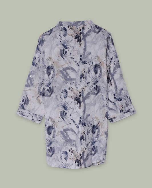 White and grey abstract printed tunic top with band collar, half button placket, three-quarter sleeves, and a curved high-low hem.