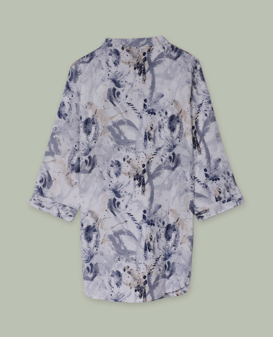 White and grey abstract printed tunic top with band collar, half button placket, three-quarter sleeves, and a curved high-low hem.