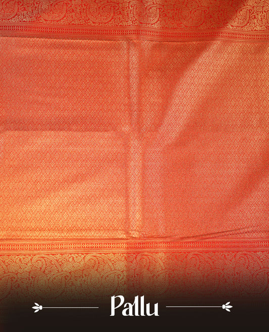 Mustard yellow colour semi soft silk brocade saree featuring elegant gold woven motifs across the body, highlighted with a contrasting red richly detailed border and pallu, paired with a matching blouse piece.