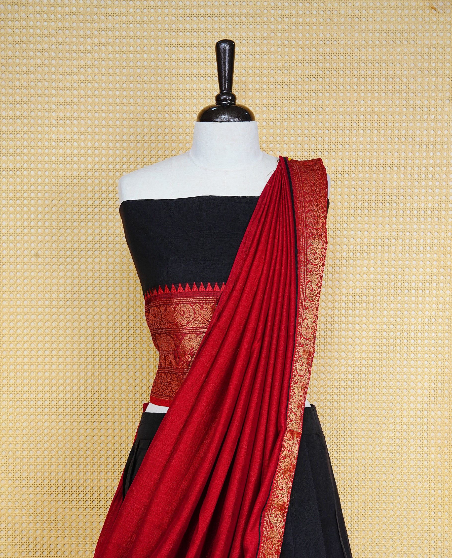 Black colour Semi Stitched Dhavni set Featuring Black Skirt With Contrast Red colour with Zari border, paired with UnStitched Blouse & Elegant Dupatta.
