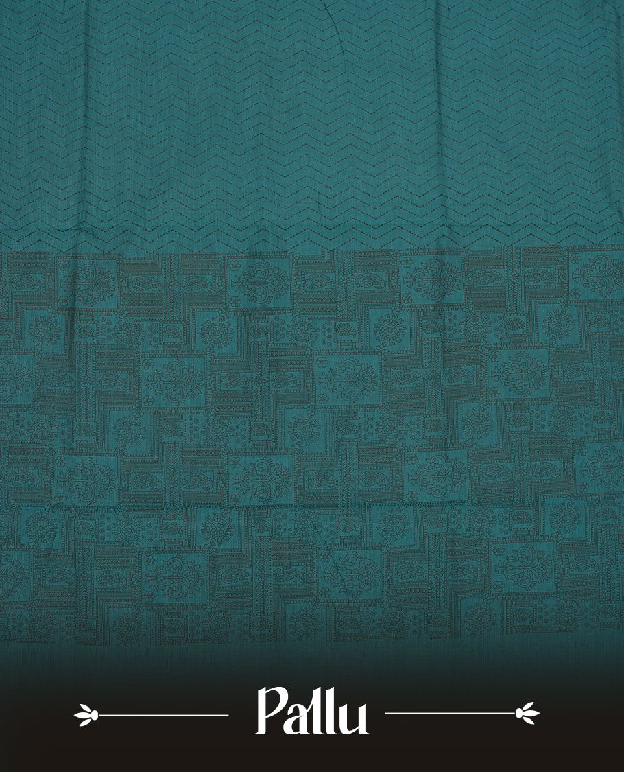 Dark Teal Green colour poly cotton saree with black zigzag line pattern on the body, paired with a matching pallu featuring black chevron lines and panelled floral‑paisley design, and a coordinated all‑over floral paisley patch‑style printed blouse piece.