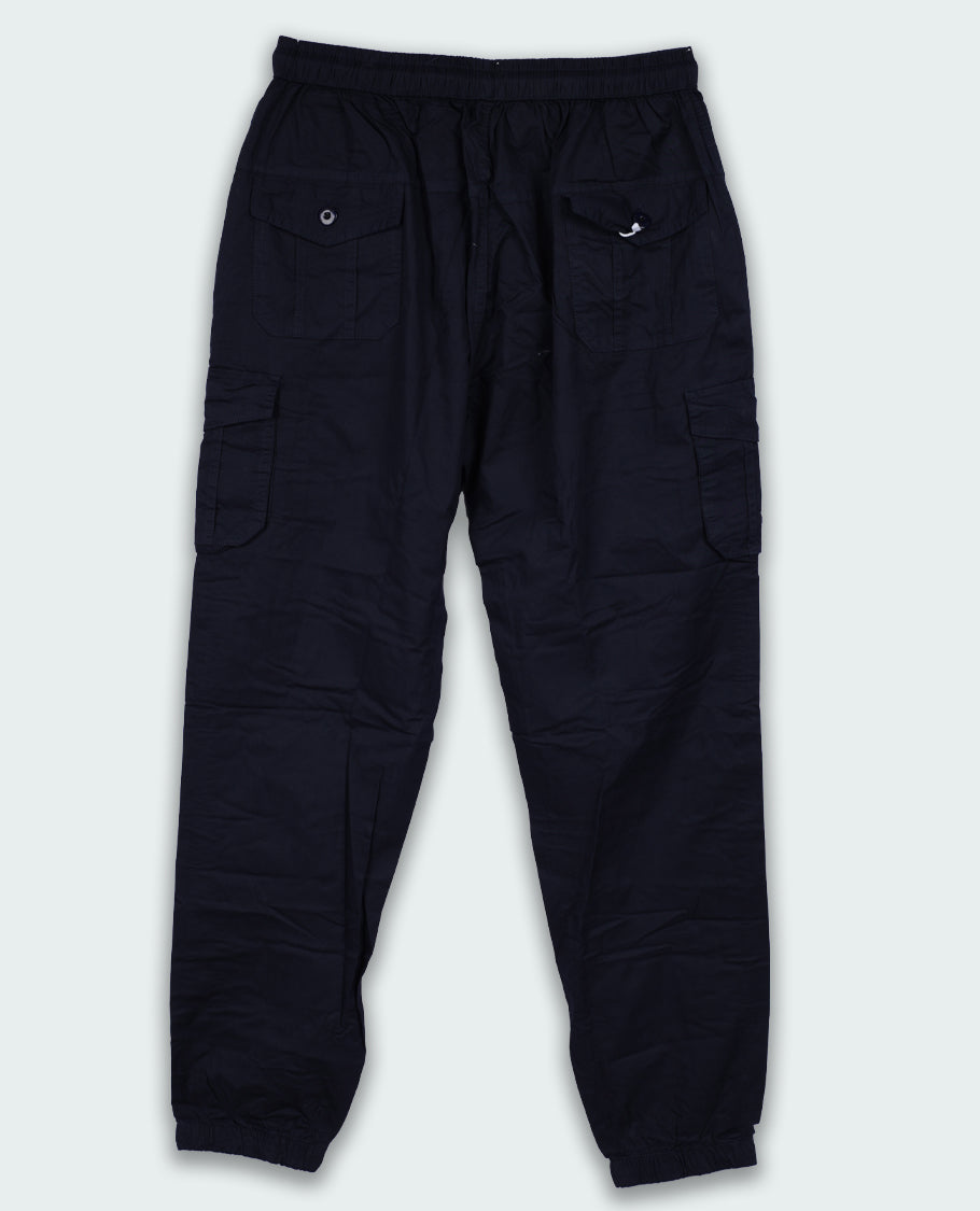Dark navy blue colour Cargo Jogger Pants, Designed in a regular fit, they feature flap pockets, a drawstring waist, and cuffed hems.