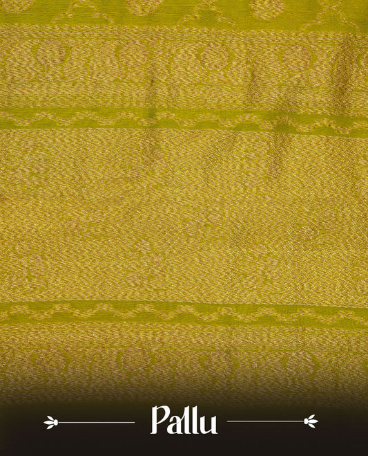 Olive colour semi Banaras saree with gold zari buta motifs, finished with a traditional gold zari border and pallu, paired with a matching blouse.