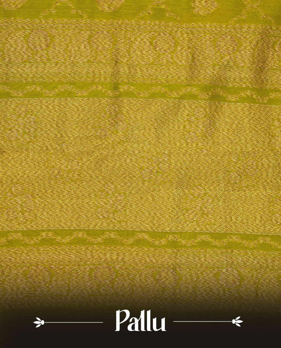 Olive colour semi Banaras saree with gold zari buta motifs, finished with a traditional gold zari border and pallu, paired with a matching blouse.
