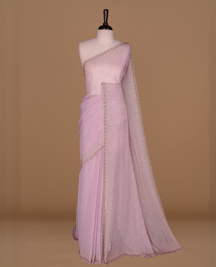 Lavender colour designer saree featuring gold & white stone worked body and border, paired with matching blouse piece.