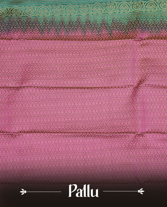 Teal colour soft silk saree featuring Gold zari  motifs on body, complemented by contrast Magenta colour with traditional border, paired with matching blouse piece.