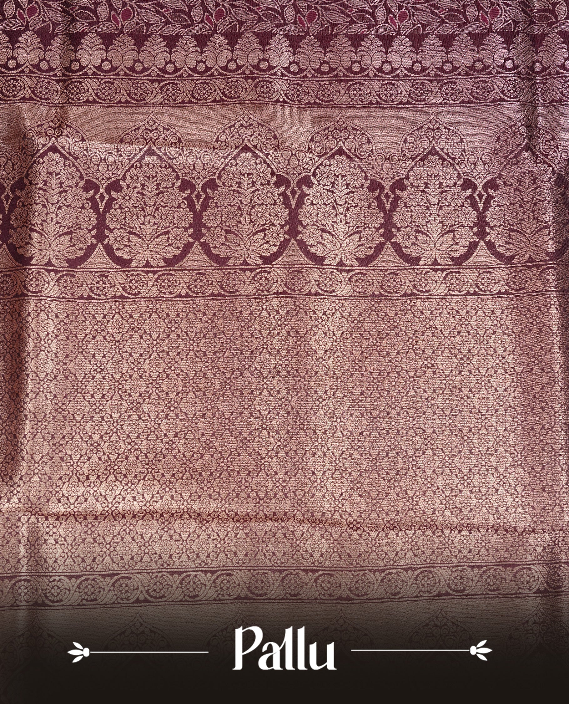 Maroon Colour Softie Silk Saree Featuring An All Over Gold Woven Leaf Pattern, Finished With A Matching Border Adorned With Intricate Paisley And Floral Motifs, Paired With A Matching Blouse Piece.