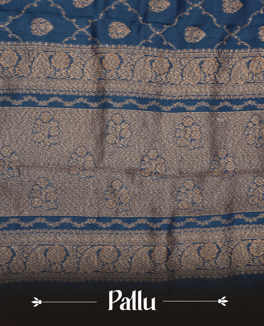 Crystal Teal colour semi Banaras saree with gold zari buta motifs, finished with a traditional gold zari border and pallu, paired with a matching blouse.