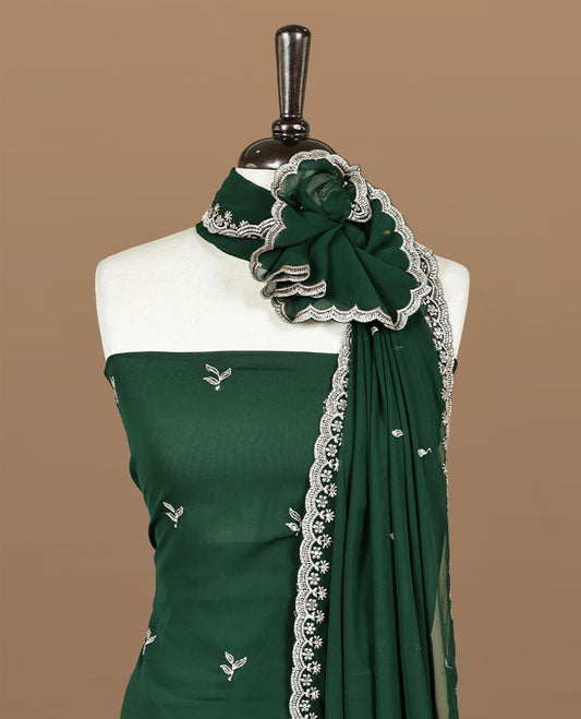 Green colour churidhar material featuring gold thread floral pattern on body, paired with matching bottom & dupatta.