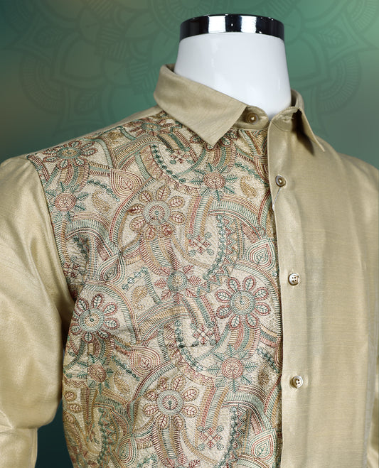Beige men’s shirt crafted in a lustrous silk finish, featuring full sleeves, a classic collar, and an elegant half body floral brocade pattern on one side, making it perfect for festive and traditional occasions.