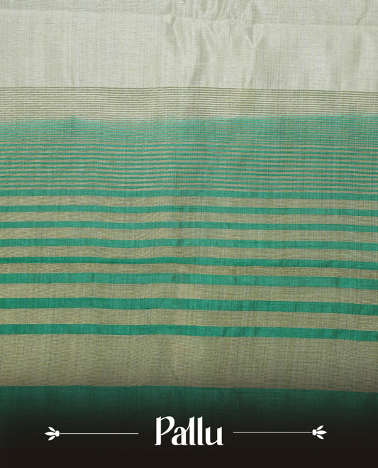 Light gold tussar saree featuring Elegant plain body, complemented by contrast green colour with Gold zari Floral kodi with Peacock Pattern border, comes with matching blouse piece.
