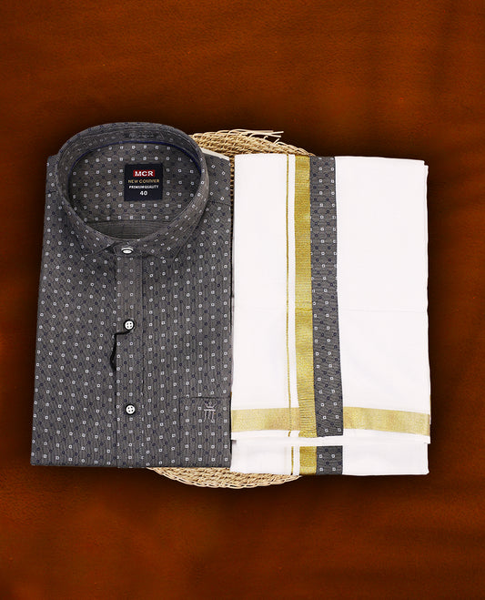 Dark grey colour MCR printed shirt featuring subtle all over motifs, paired with a white dhoti highlighted with an elegant golden zari kara and a matching dark grey printed border.