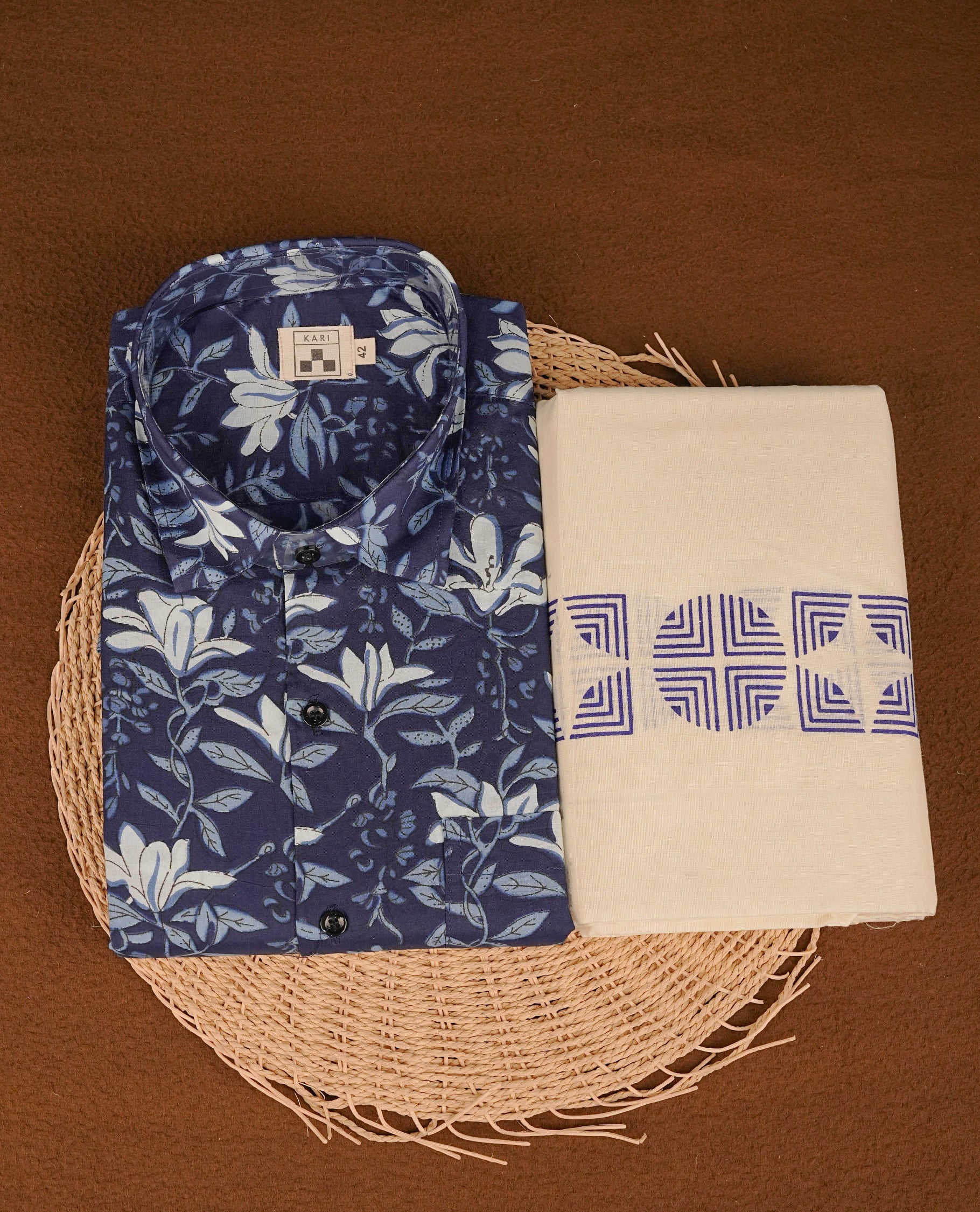 Dark Blue colour shirt featuring Floral Pattern printed body, paired with cream colour double dhoti featuring Same Colour printed border.