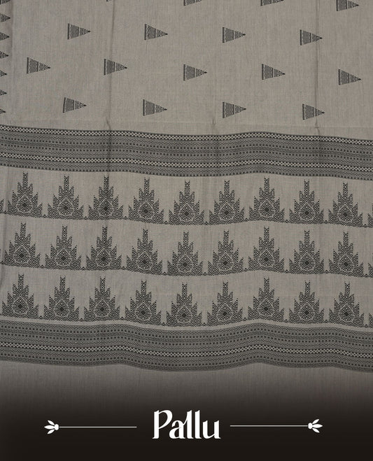 Gray colour poly cotton saree with black temple motifs on the body, paired with a matching with black woven traditional border, and a coordinated all‑over geometric printed blouse piece.