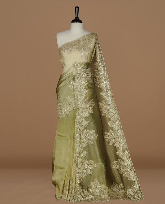 Green & gold double shade organza saree featuring thread & cut beats, sequins leaf pattern on body, highlighting scalp border, paired with matching blouse piece.