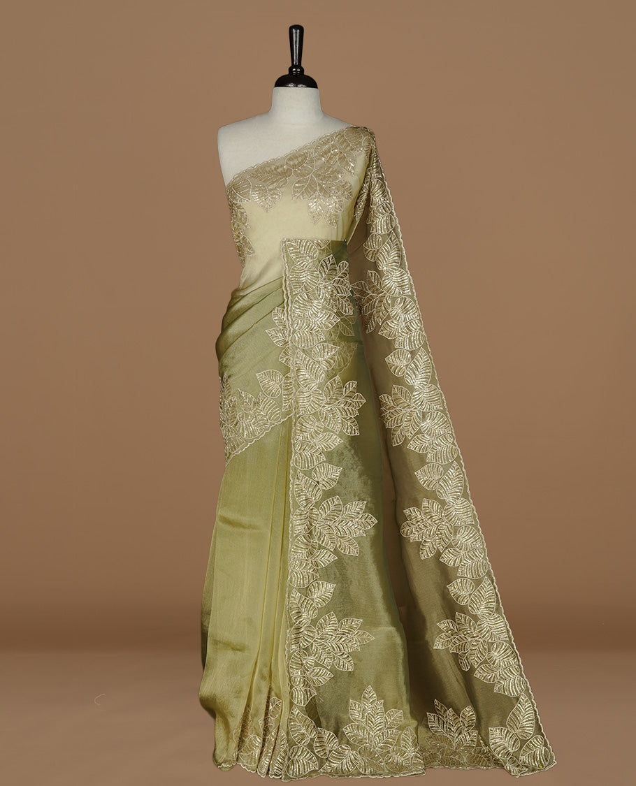 Green & gold double shade organza saree featuring thread & cut beats, sequins leaf pattern on body, highlighting scalp border, paired with matching blouse piece.