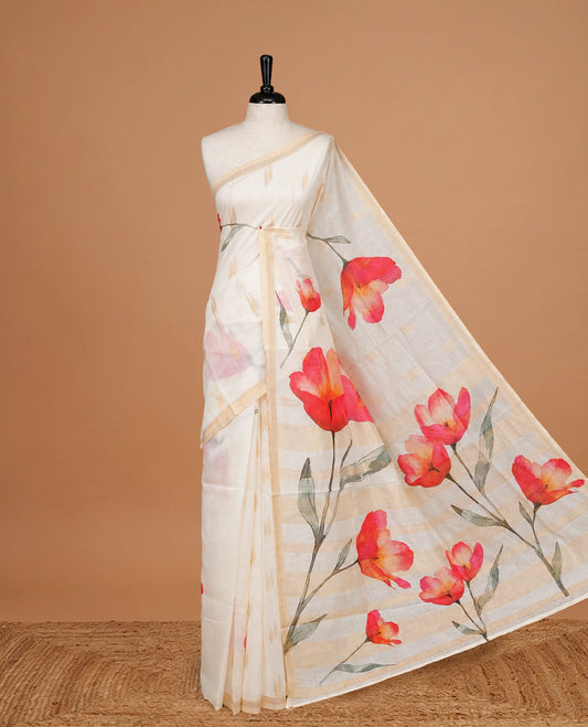 Cream Colour Organza  Kerala Saree Featuring Red Floral Print On The Body, Tassels On The Pallu With A Matching Blouse Piece.