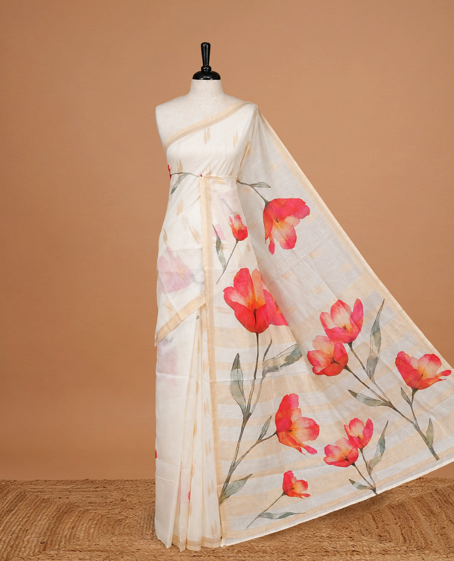 Cream Colour Organza  Kerala Saree Featuring Red Floral Print On The Body, Tassels On The Pallu With A Matching Blouse Piece.