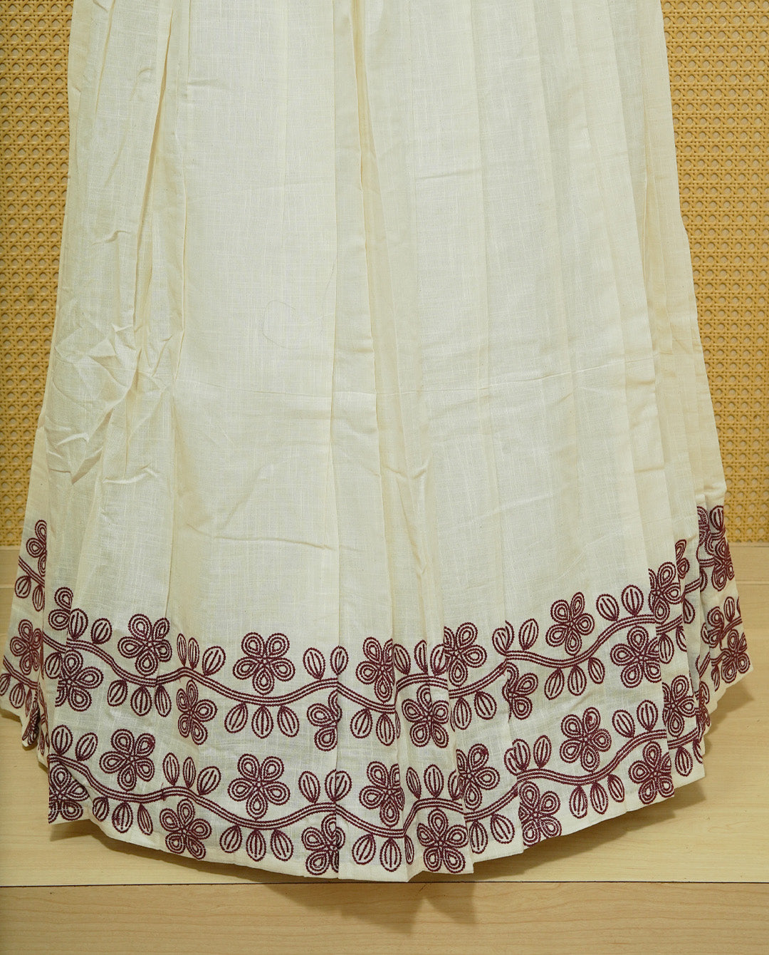 Cream colour cotton Stitched Skirt With Maroon colour Floral thread pattern on the border.