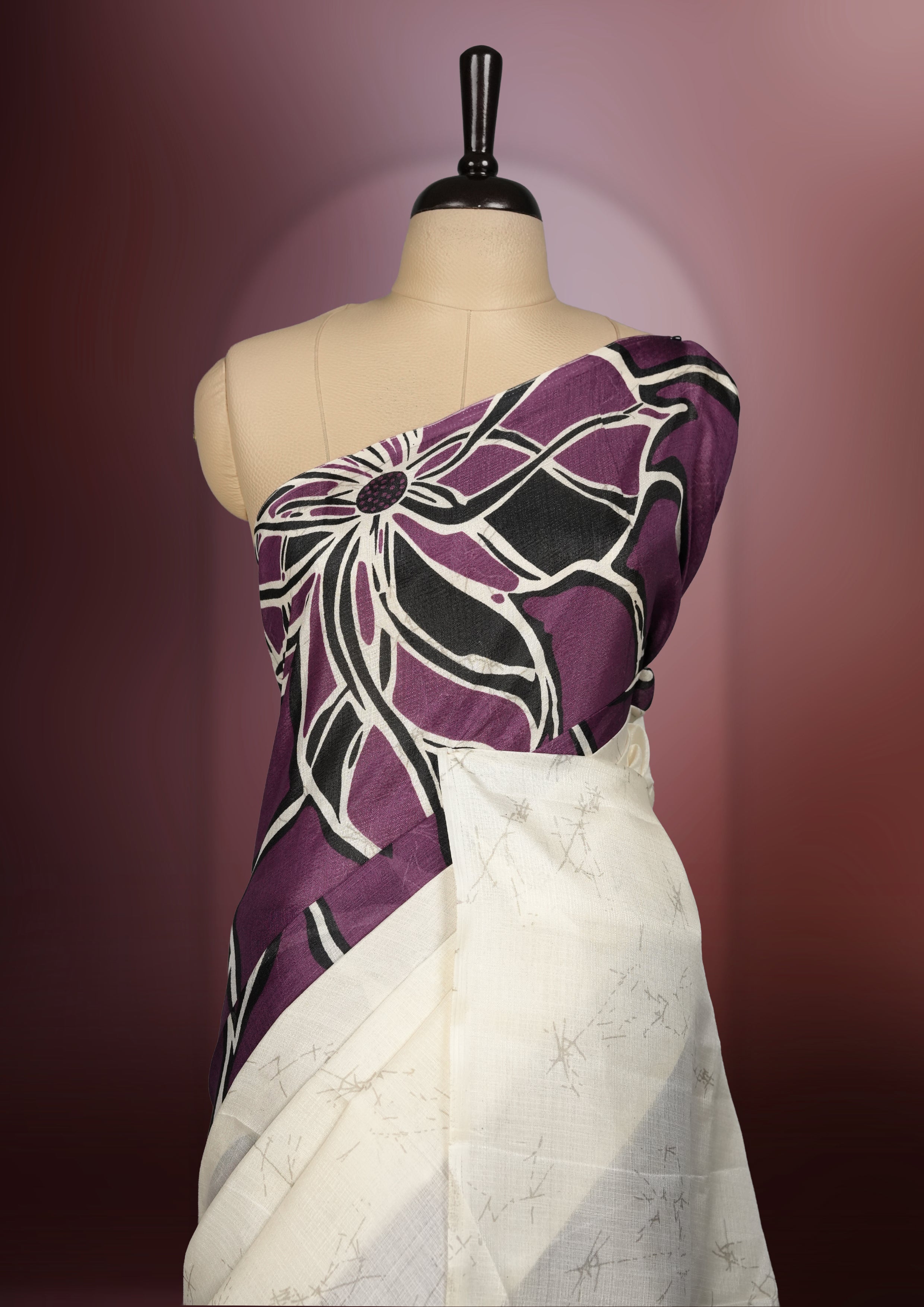 Deep wine and ivory colour saree with bold floral body, abstract line printed pallu, and a minimal border & A perfect blend of modern artistry and tradition, paired with a matching blouse for a complete look.