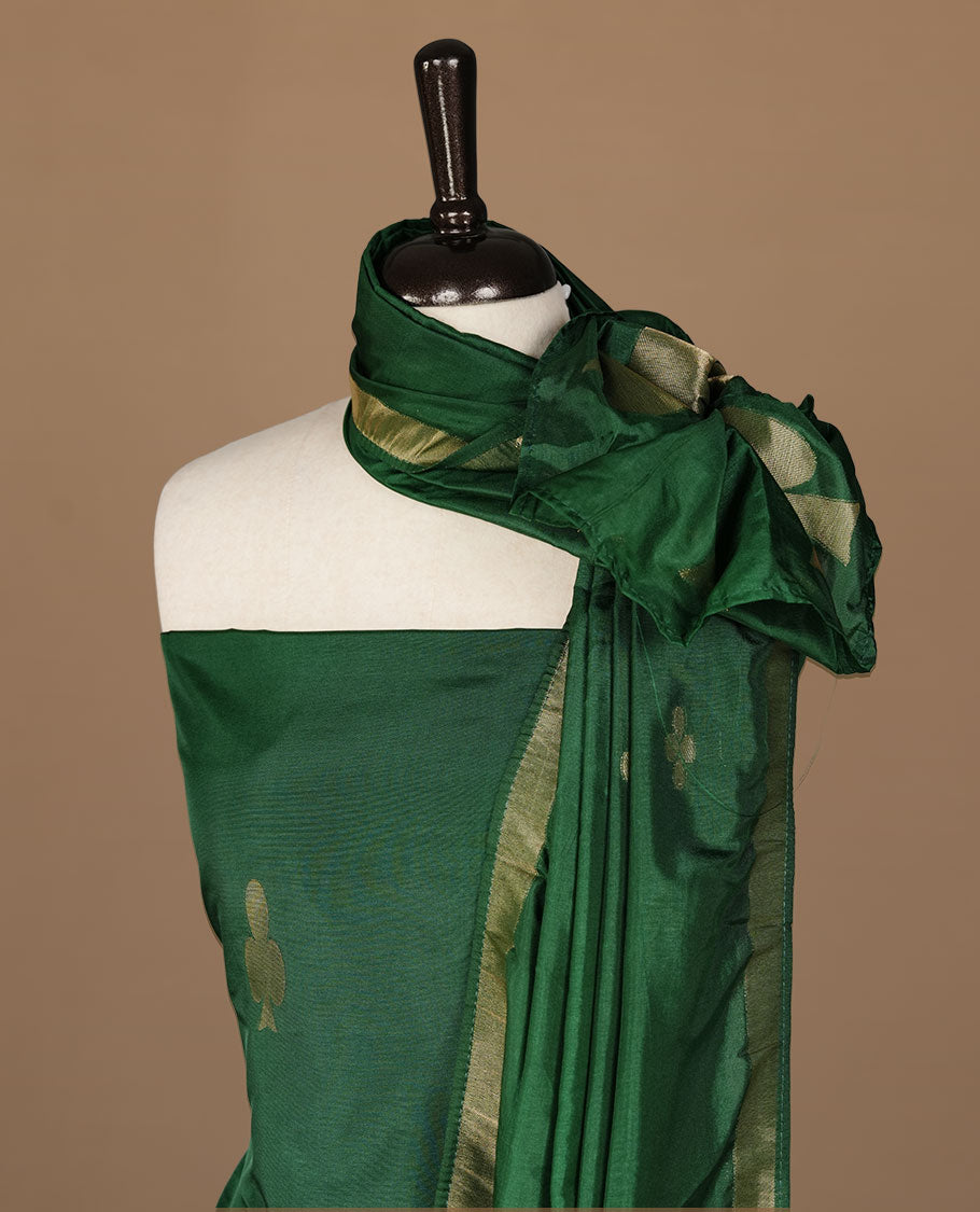 Green colour churidar materal featuring gold zari card pattern on body, border, paired with matching bottom and dupatta.