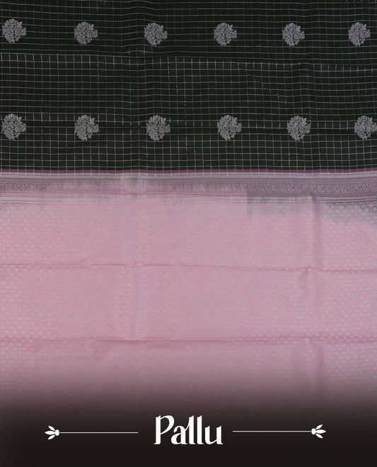 Black colour semi silk saree highlighting silver zari check pattern  and motifs across body, featuring contrast baby pink colour border with silver zari pattern, comes with matching blouse .