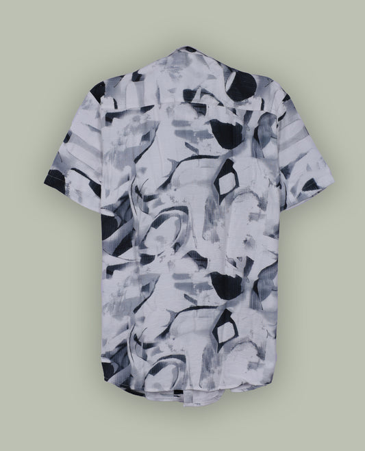 White colour shirt featuring bold green abstract brushstroke patterns, Styled with a classic collar and short sleeves, it brings a modern, artistic edge to your casual wardrobe.