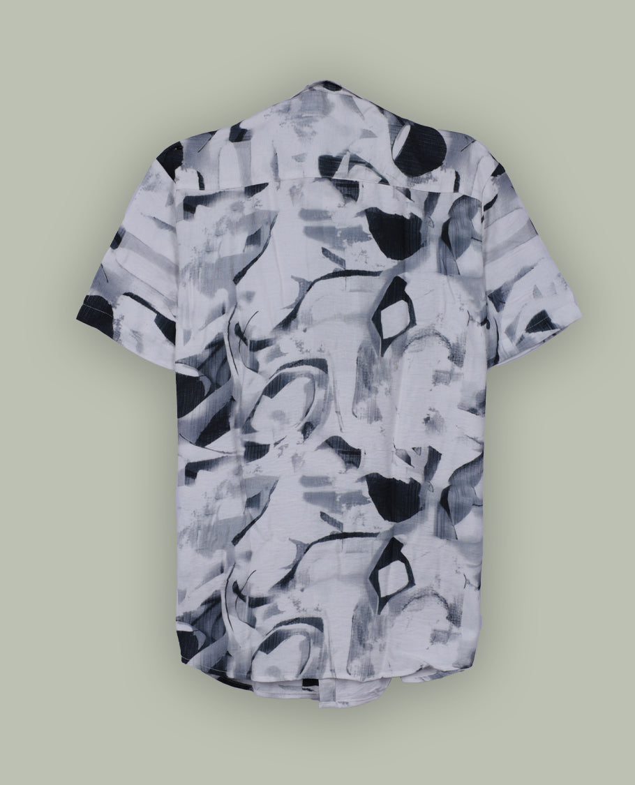 White colour shirt featuring bold green abstract brushstroke patterns, Styled with a classic collar and short sleeves, it brings a modern, artistic edge to your casual wardrobe.