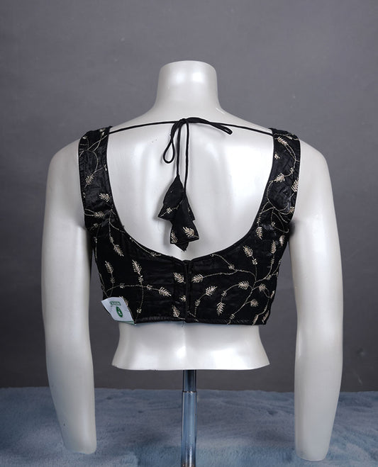 Black embroidered padded blouse with gold vine detailing, V neckline, and tie-back finish.