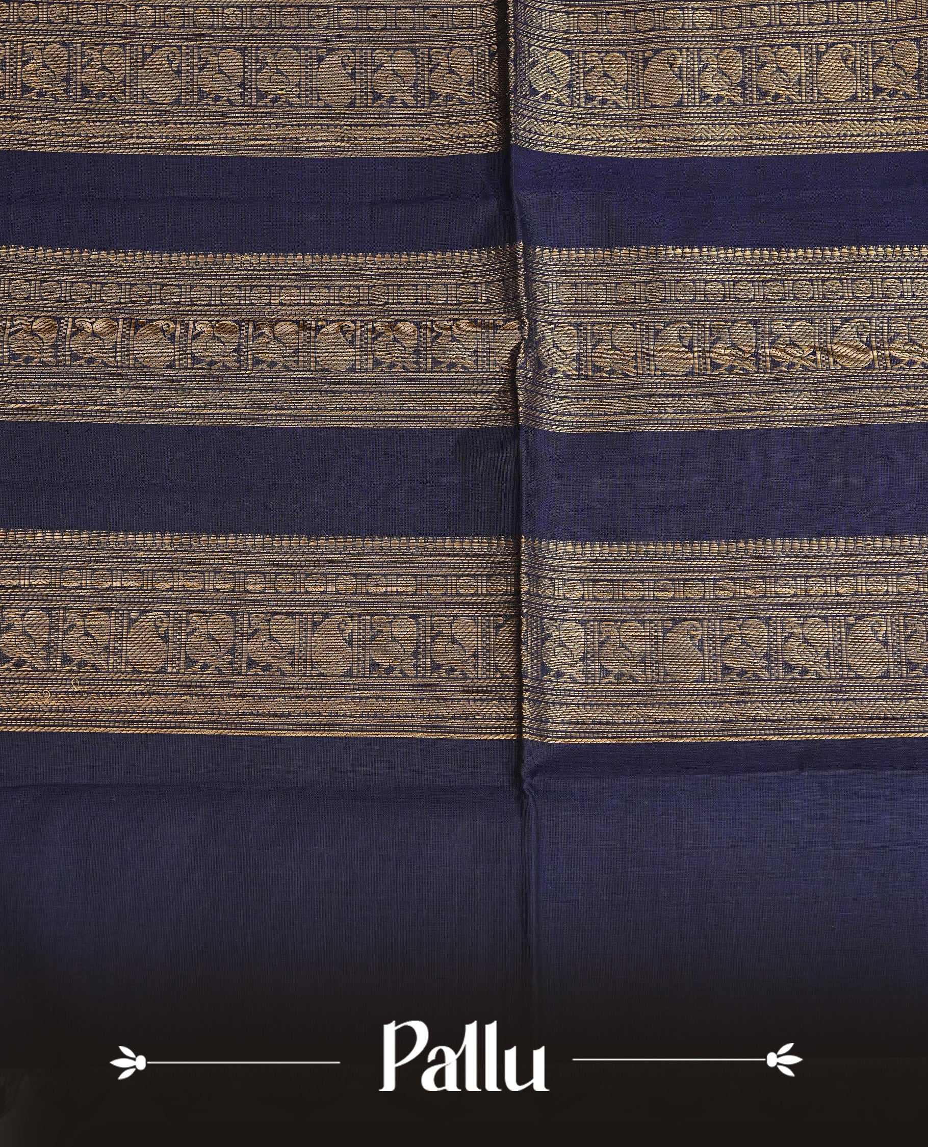 Navy blue colour chettinad cotton saree featuring gold zari motifs on body, complemented by contrast green & magenta with gold zari border, comes with matching blouse piece.